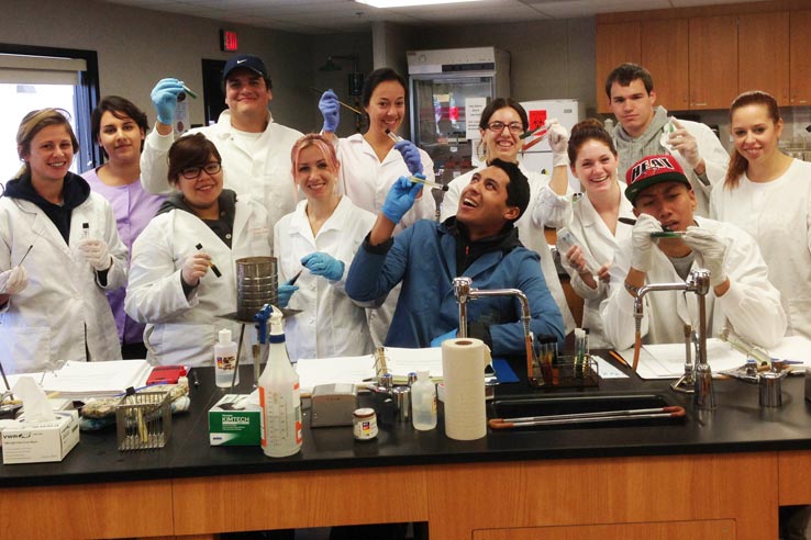 A group of students in lab coats.
